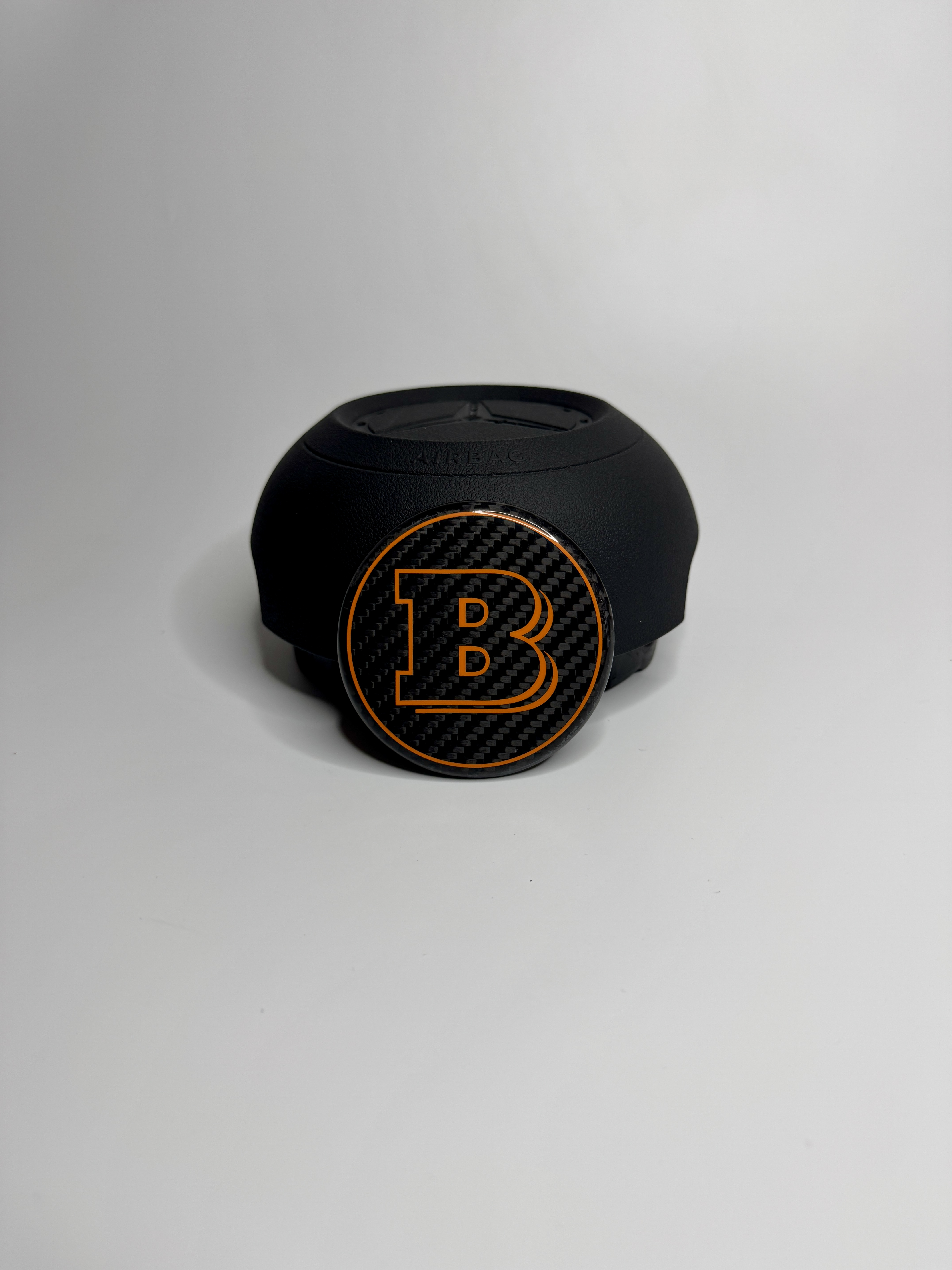 Emblemat Brabus Orange na poduszce powietrznej do Mercedesa G-Class W463A W464