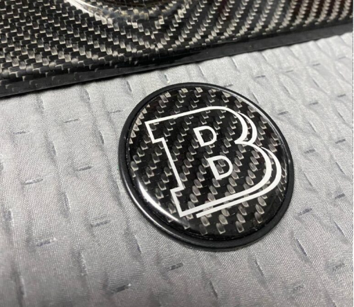 Metalowy emblemat maski Mercedes-Benz W463A W464 G-Class styl Brabus grey 55 mm