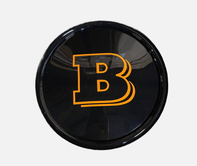 Emblemat grilla plastikowy Mercedes-Benz W463A W464 2018-2024 G-klasa styl Brabus orange